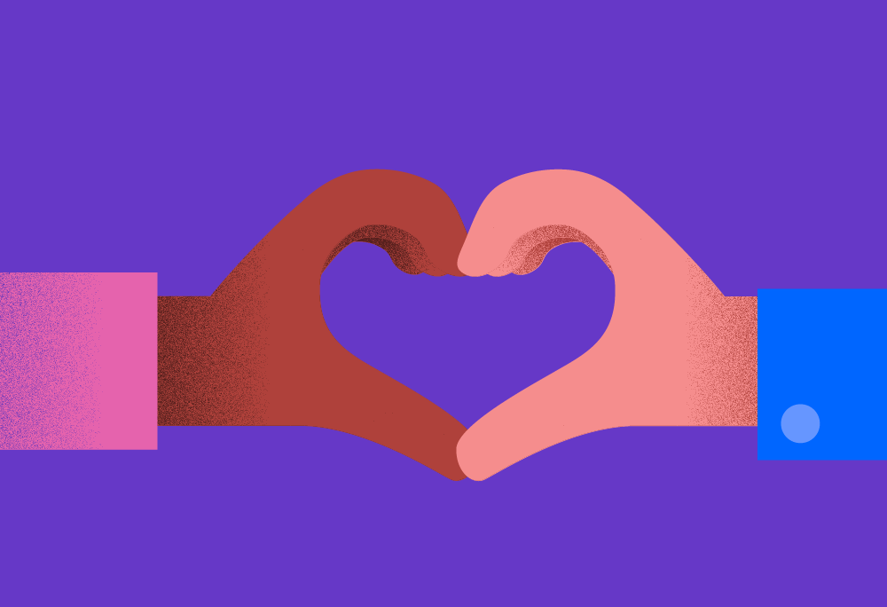 Two hands come together to make a heart shape
